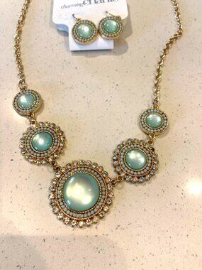 Charming Charlie Elegant Gold and light green Statement Necklace and earrings.